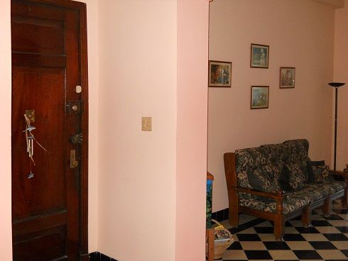 'Living room and entrance to the apartment' 