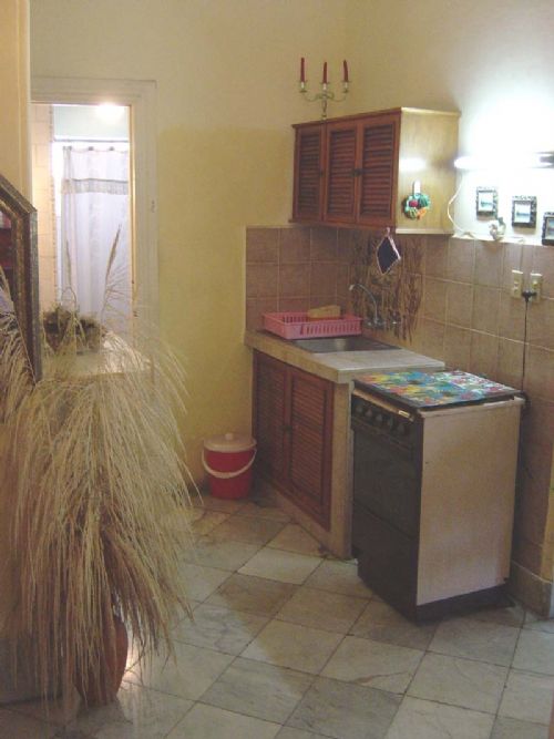 'Kitchenette and you can also view the bathroom door' Casas particulares are an alternative to hotels in Cuba.